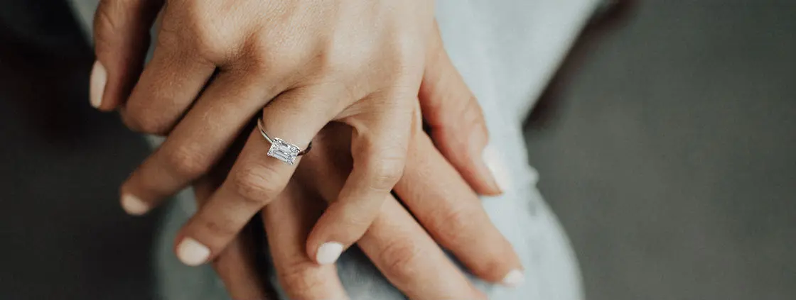 emerald cut engagement rings womans hands desktop.jpg